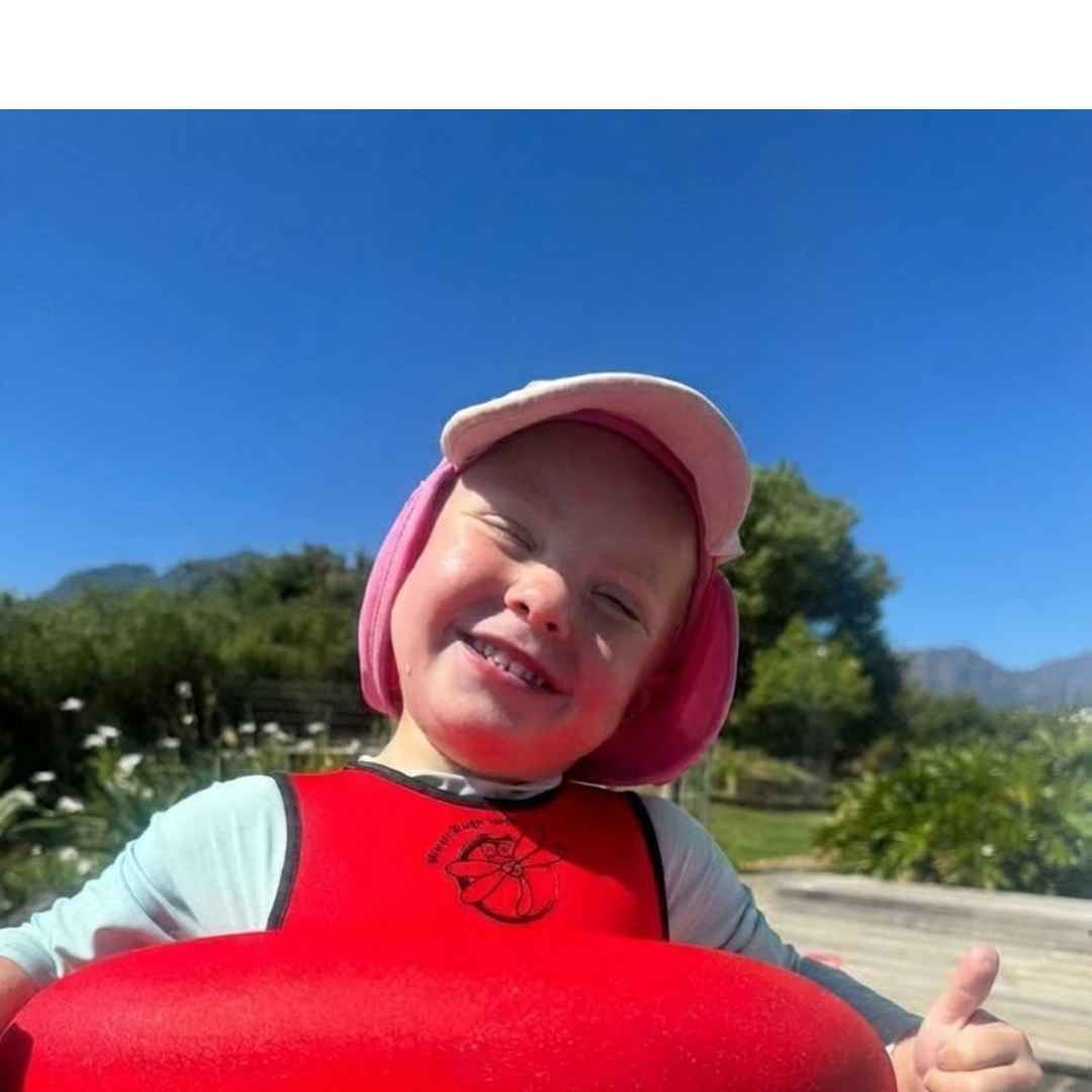 Girl with pink cap giving thumbs up with Water-Bugs