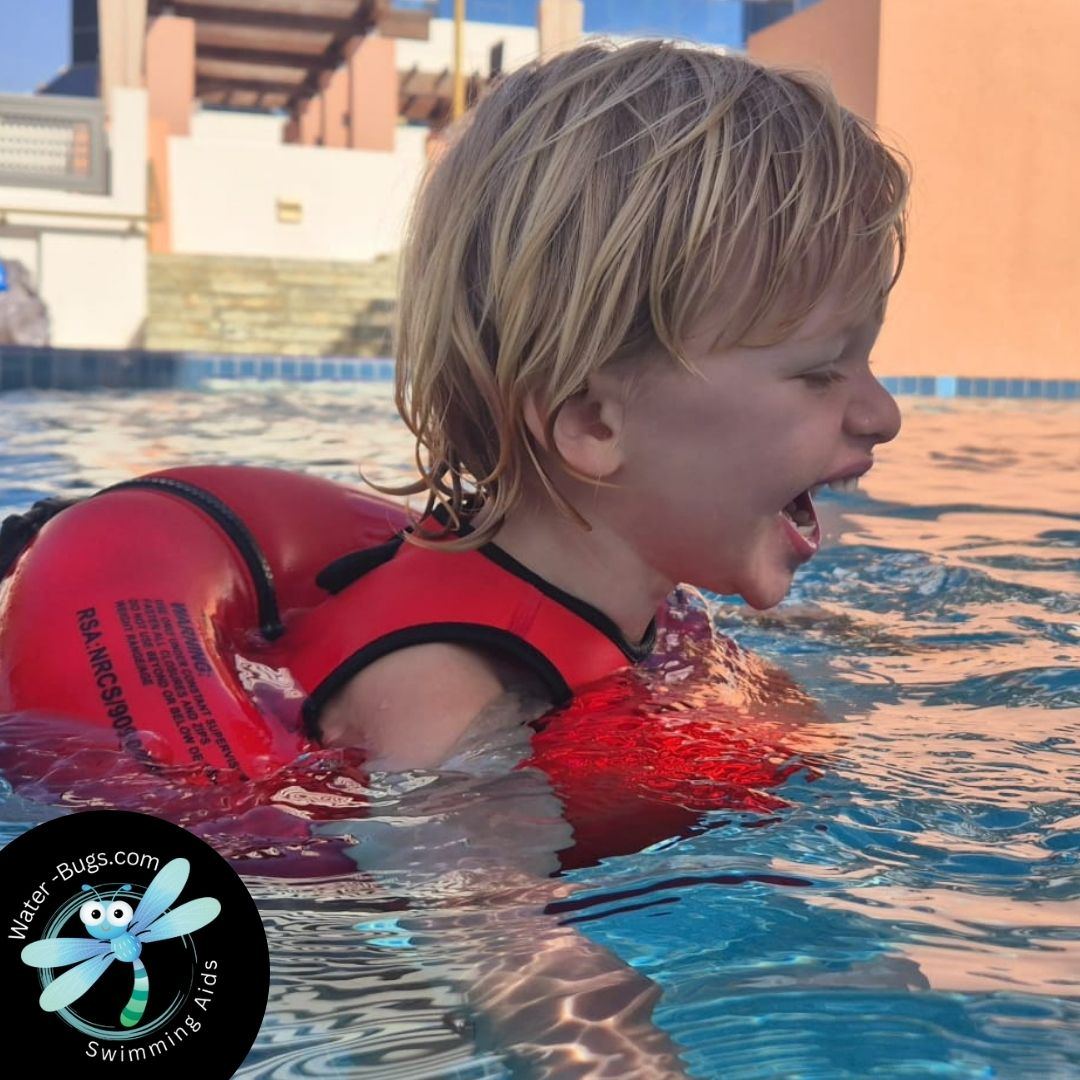 Boy screaming with excitement in the pool